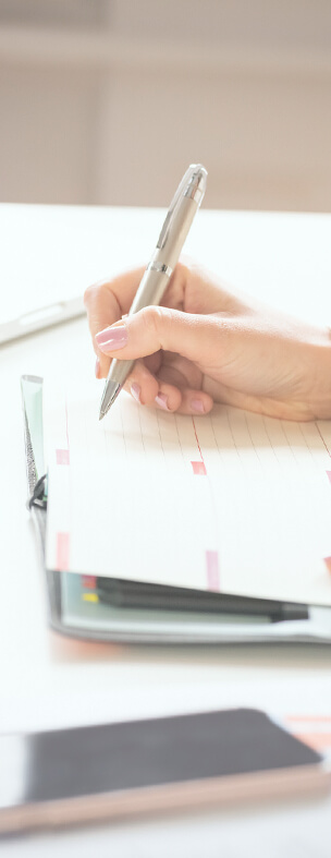 woman writing with a pen